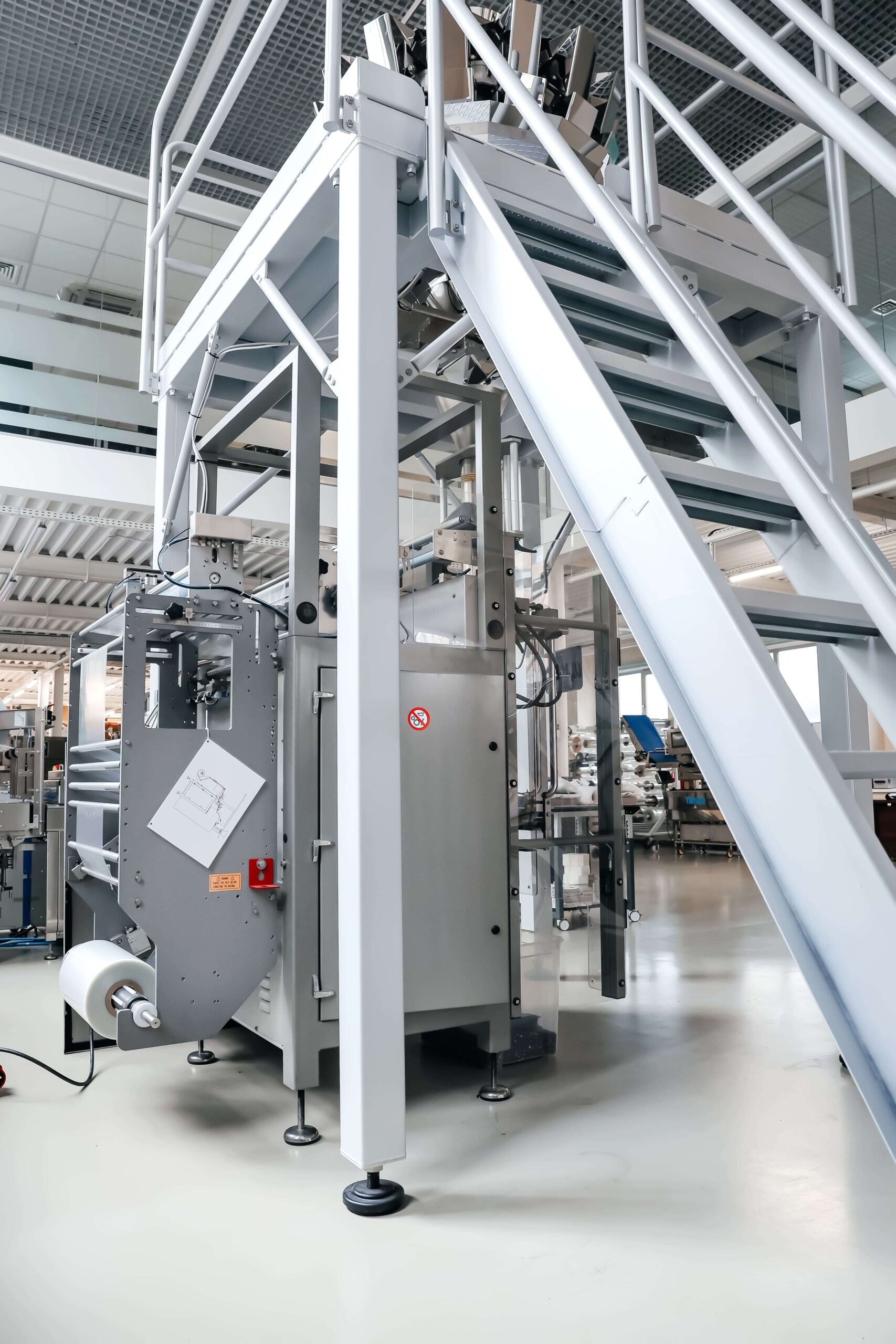 Máquina envolvedora de flujo vertical - Servicios Genius